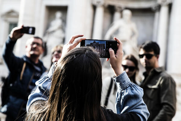 Tourists at the Trevi Fountain in the center of Rome